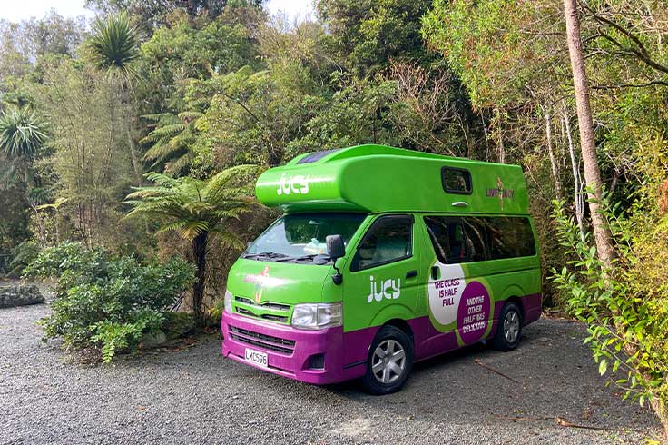 JUCY Campervan parked at campsite in Franz Josef Rainforest Retreat
