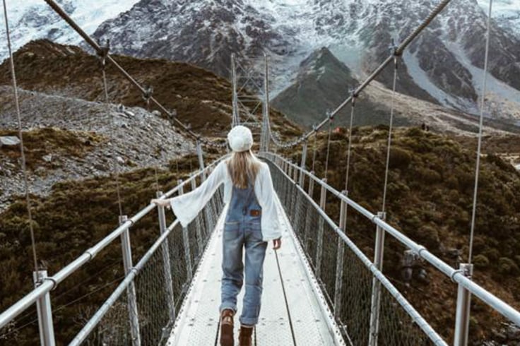 Girl on rope bridge in winter